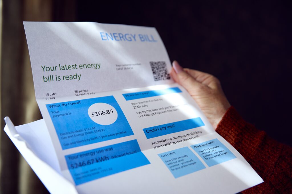 hand of a person checking their energy bill